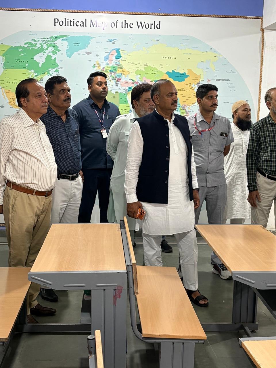 Waqf Chairman and visitors in a DSS School classroom