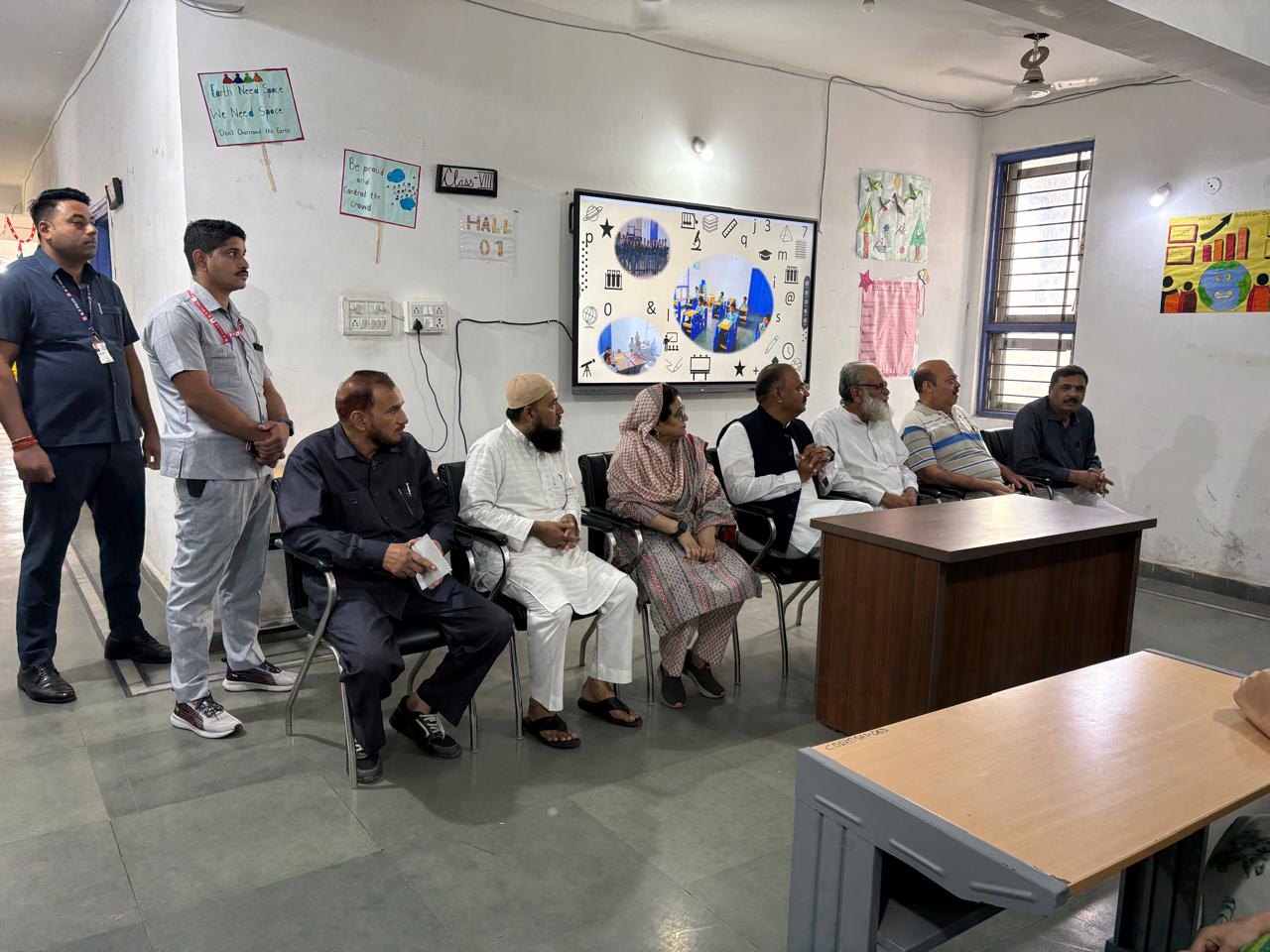 Waqf Chairman with school representatives during the visit